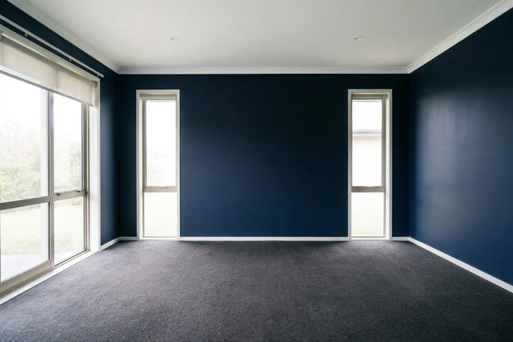 After — facade in Naval Navy (SW 6244) with Pure White on the trim and ceiling (Modern)