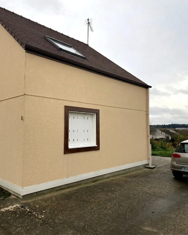 After — facade in Warm Beige (RAL 1001) with Espresso Brown on the roof (Traditional)