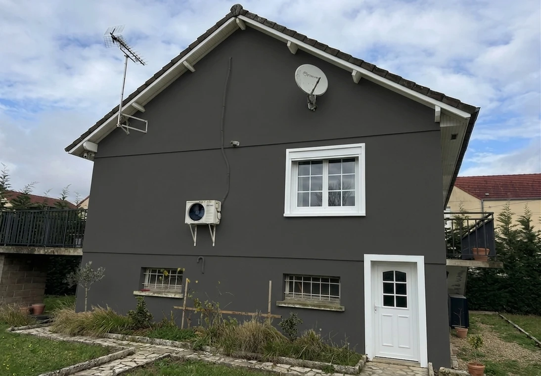 After — facade in Iron Ore Charcoal (SW 7069) with Pure White on the trim (Modern Farmhouse)