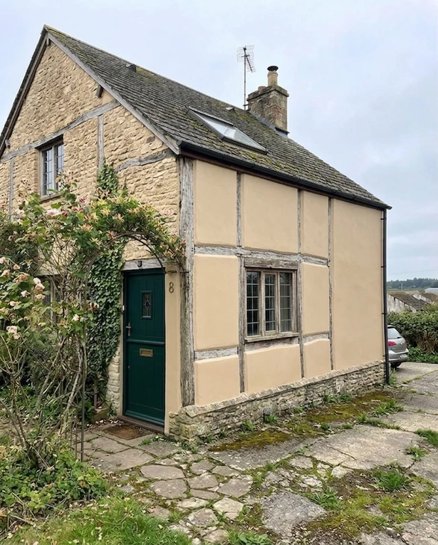 After — facade in Cotswold Stone (BS 10 C 33) with Forest Green on the front door (Traditional English / Cottage)