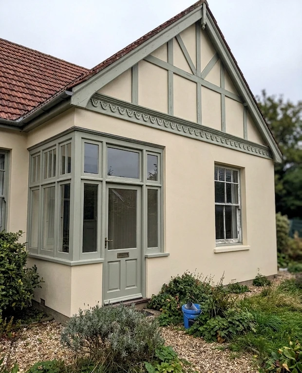 After — facade in Slipper Satin (Farrow & Ball No.2004) with Lichen on the sash windows, bay frame, gable trim (Edwardian)