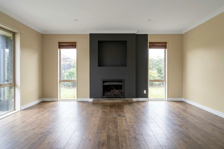 After — facade in Accessible Beige (SW 7036) with Iron Ore Charcoal on the fireplace wall and shelving (Modern Transitional)