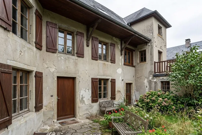 Two-story exterior before AI color preview (warm khaki family)