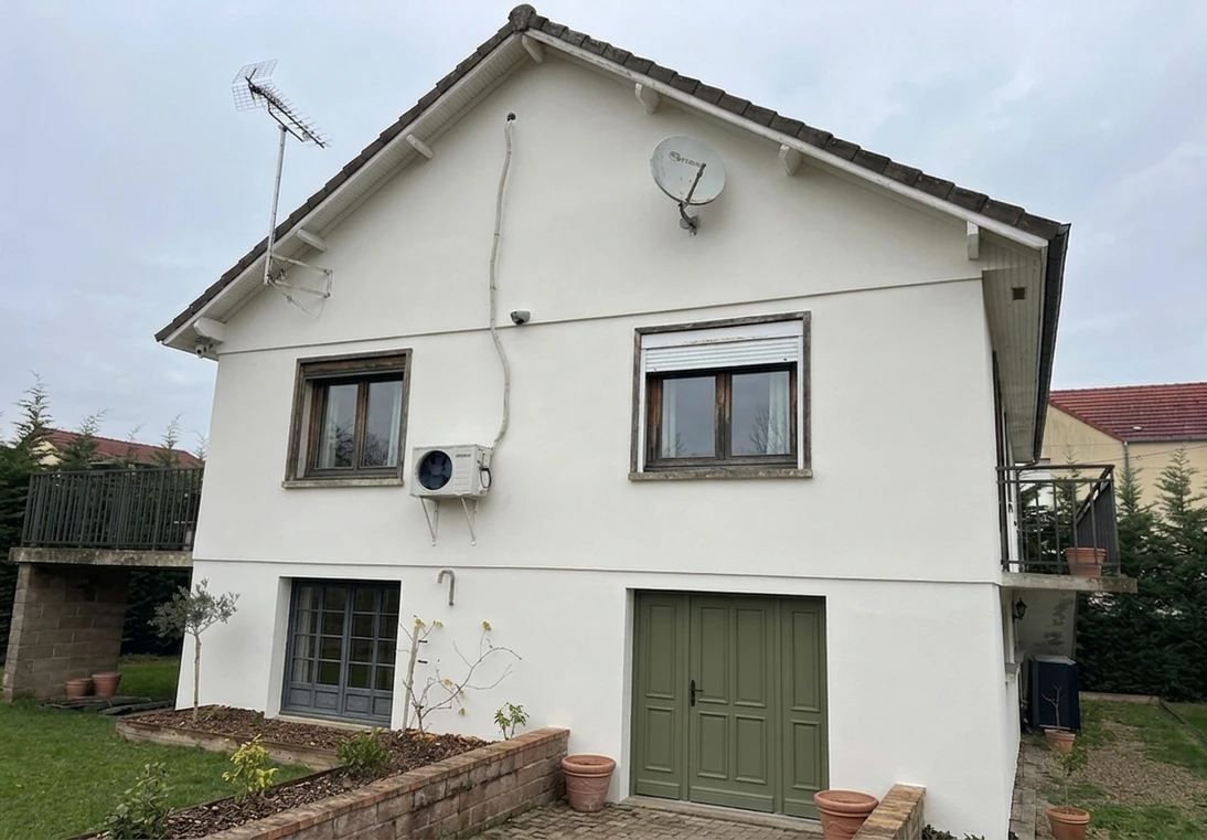 After — facade in Simply White (RAL 9003) with Olive Green on the front door (Modern Farmhouse)