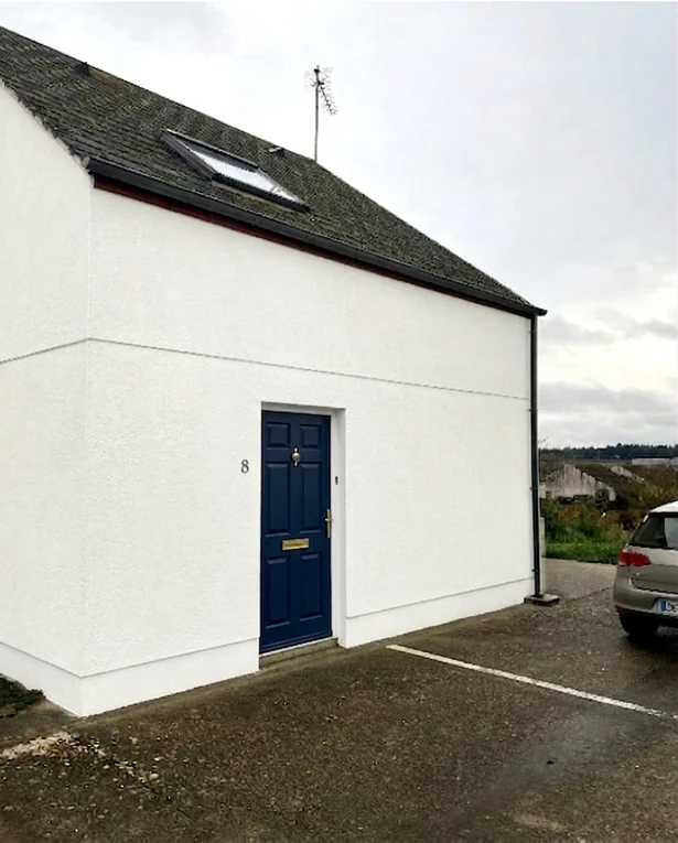 After — facade in Brilliant White (RAL 9010) with Naval Blue on the door (Georgian)