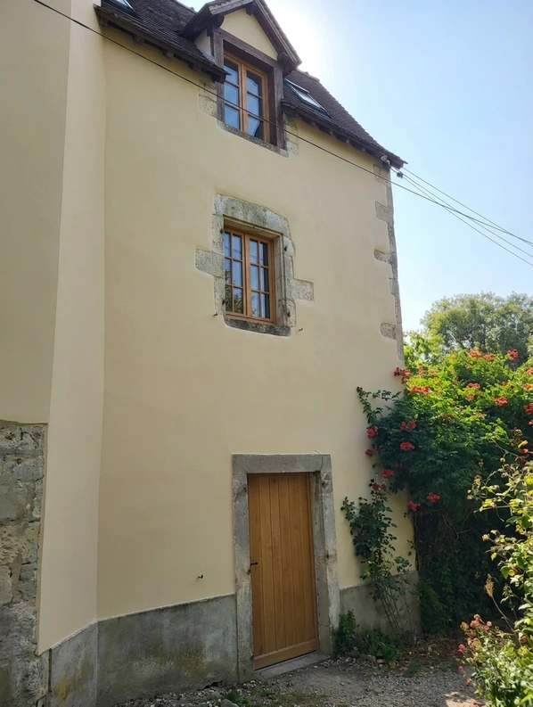 After — facade in Pale Cotswold Stone (None) with Natural Oak on the front door and window frames (Cottage)