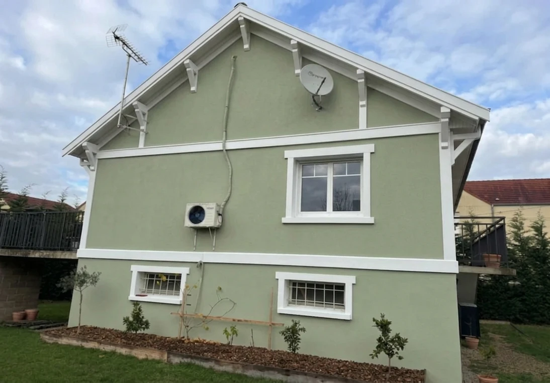 After — facade in Sage Green (RAL 6021) with Bright White on the trim (Craftsman)